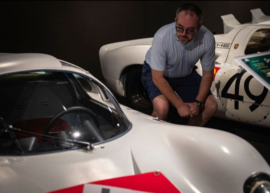 A person looking a car