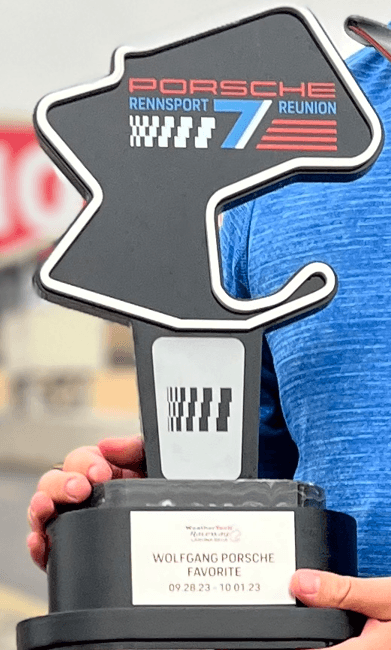 A man holds a trophy